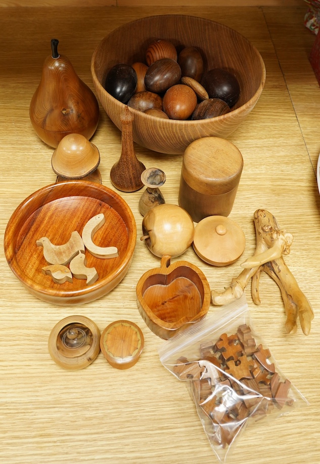 A quantity of modern treen items to include fruit bowl, puzzle and boxes & covers, one in the form of a pear, largest 23cm in diameter. Condition - mostly good